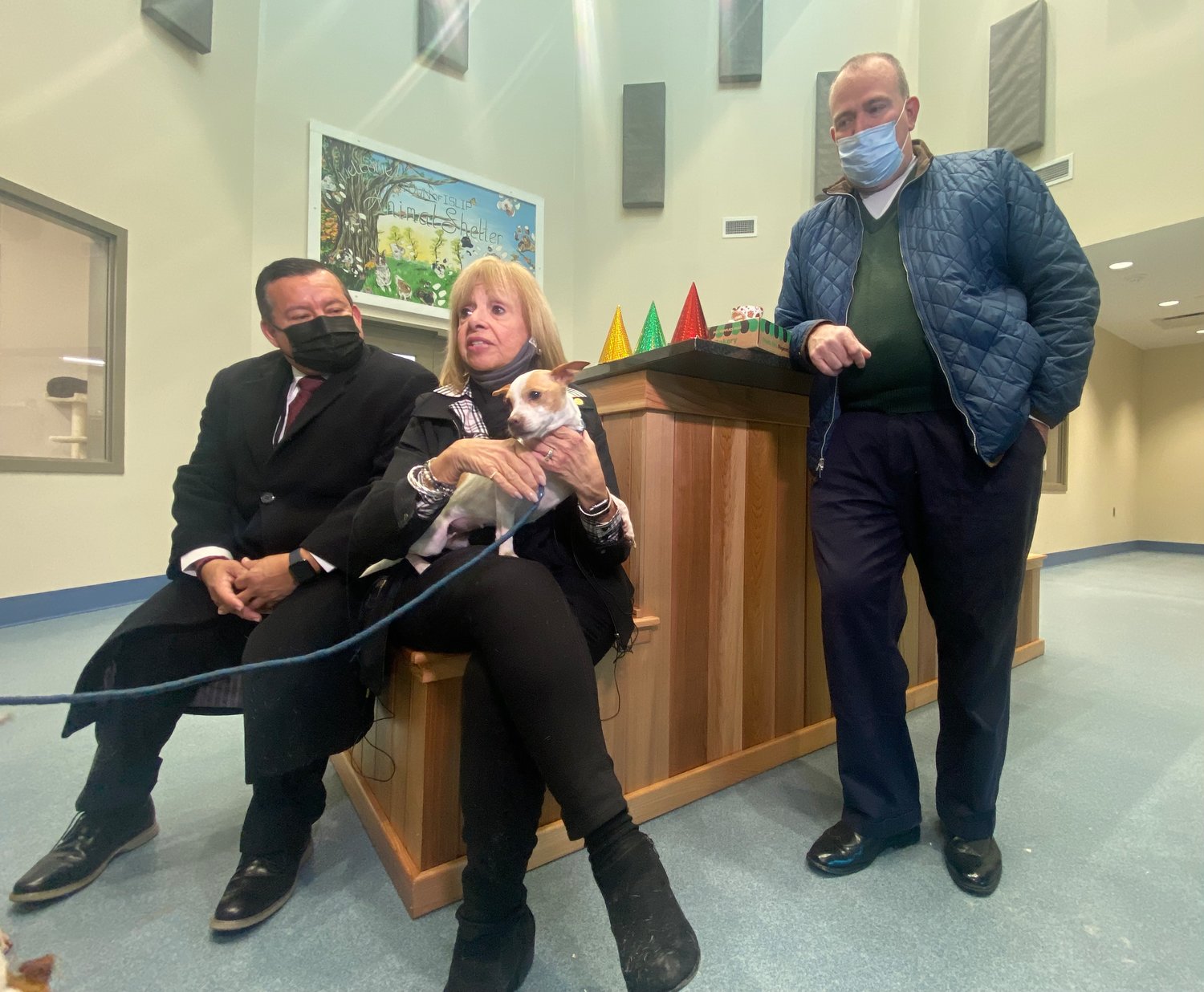(From L to R) Town councilman Jorge Guadron, Islip Town supervisor Angie Carpenter and town councilman Jim O’Connor. Pup Allie sits on Carpenter’s lap.